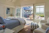Guest cottage french doors provide welcome access to a sunny iconic courtyard.
