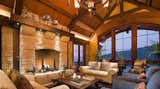 Great room with mountain view and fireplace.  Photo 1 of 3 in Park City Ski Retreat by NSPJ Architects