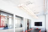 A double Ray fixture by LightArt. Photographed in a NYC firm's conference room. 