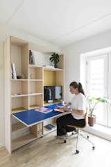 When it’s the week after and the children have left, the Murphy bed can be stowed away and the working desk placed on the opposite wall can be folded down. 
