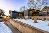 Outdoor, Shrubs, Side Yard, Walkways, Concrete Patio, Porch, Deck, Hardscapes, Wood Fences, Wall, and Metal Patio, Porch, Deck From street elevation   Photo 2 of 9 in A Ralph Evans Home by Mony Ty / Summit Sotheby's 