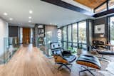 Living Room, Ottomans, Medium Hardwood Floor, Recessed Lighting, Ceiling Lighting, Chair, and Floor Lighting Sitting room over looking the lower level.   Photo 4 of 9 in A Ralph Evans Home by Mony Ty / Summit Sotheby's 