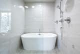 Bath Room, Stone Counter, Ceiling Lighting, Enclosed Shower, Freestanding Tub, Ceramic Tile Wall, and Recessed Lighting Master bath  Photo 8 of 9 in A Ralph Evans Home by Mony Ty / Summit Sotheby's 