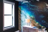 Suit stitch wallcovering against geographical mural.