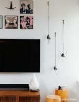 Living Room, Media Cabinet, Stools, Ceiling Lighting, Floor Lighting, and Dark Hardwood Floor  Photo 3 of 13 in Fort Greene Modern Scandinavian by Designs by Human.