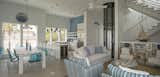 The open kitchen and living room have extensive views of the state park. A pneumatic glass elevator saves space and opens up the views in the room. 