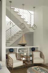 The interior of the stairway has lots of light and large openings. 