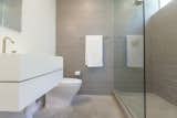 Modern fixtures with Italian tile result in an elegant master bath with clean lines