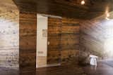 Clever hardware allows the doors to "disappear" into the walls when closed