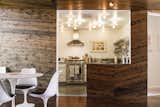 The Kitchen as seen across the Dining Room: The combination of materials and tones results in extraordinary visual interest