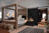 1,400lb King Bed.  Built in the space from extra timbers not used in the construction of the home.  20" wide oak planks make up the head and foot boards.  4' wide sliding doors, 4' wide traffic areas through the home to provide ease of flow, wide plank oak flooring milled my hand onsite, all wood walls and ceilings.