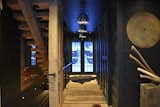 Leading through the house.  Central Foyer is a display of symmetry.  Angus hides.  Axes on display.  Wide plank oak flooring all rough sawn and hand brush sanded.
