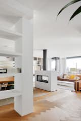 Living Room, Two-Sided Fireplace, and Light Hardwood Floor  Photo 3 of 25 in Beautiful Duplex in Barcelona by CONTI, CERT