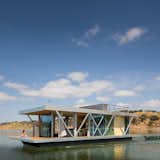 floating homes one story floating houseboat with metal siding accents