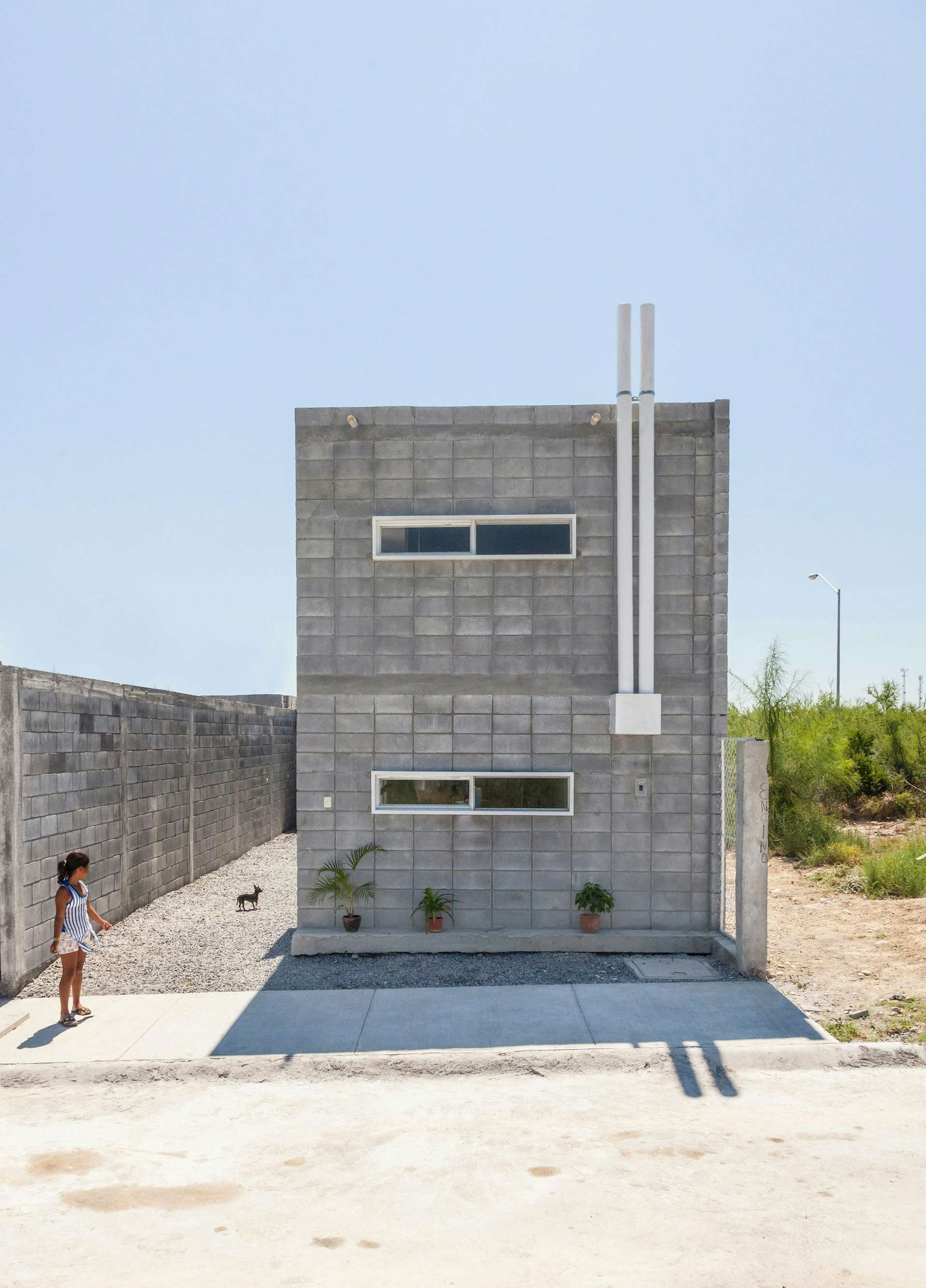 Mexico-based architecture office S-AR created Casa Caja with support from a nonprofit social housing project. The low-cost concrete-block house is designed to be built by its owners.