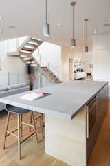San Francisco Renovation kitchen island with grey quartz countertops and grey pendant lighting