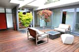 Outdoor, Trees, Wood Patio, Porch, Deck, Small Patio, Porch, Deck, and Hardscapes  Photo 8 of 11 in An Interior Designer Launches Her Career by Renovating Her Family’s Midcentury Eichler