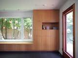 Mudroom with custom cabinets, bench, tile floor