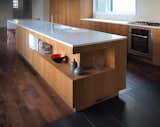 Detail at kitchen island: integral sink, recessed shelf