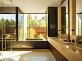 Bath Room, Tile Counter, Drop In Sink, Limestone Floor, Alcove Tub, Recessed Lighting, and Enclosed Shower California Meadow House | Olson Kundig   Photo 19 of 20 in California Meadow House by Olson Kundig