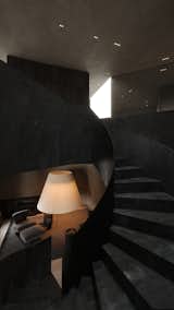 A sculptural staircase in dark tones leads to a cozy lounge with soft lighting, creating a dramatic yet inviting space.

#EO3H #sirotovarchitects #architecture
