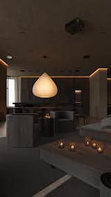 A warm, intimate lounge area with a large pendant lamp and candlelit accents creates a cozy atmosphere.

#EO3H #sirotovarchitects #lounge