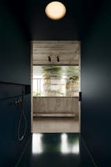 
A modern and minimalistic bathroom design where sleek, dark walls complement the industrial concrete accents, creating a serene and stylish atmosphere. #mb3h #modernbathroom #minimalism #concretedesign