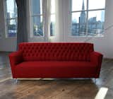 This beautiful red Cleo sofa was hand-tufted and made with a complex system of eight-way hand-tied springs in the tight-cushioned seat.
