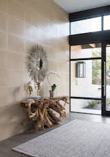 Entry with root buffet imported from Indonesia.  Western window and door.  Photo 8 of 8 in Industrial Modern Home built by husband and wife team by Renee' Criswell Champion