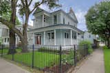 Victorian Farmhouse with restored front door & gas lanterns.  Unique corner lot placement allowed for 2 front doors.