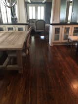 The dining room was renovated by fixing the floors, adding trim to the pillars and updating the seating at the dining room to provide better flow throughout the house.  