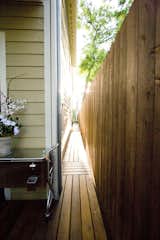 A side entrance was created so that when entertaining, guests could proceed directly to the backyard. Previously, this was dirt filled area that had little use.