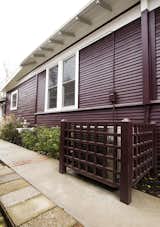 Hardscaping a path to the rental unit enhanced by landscaping brought a warmth to the house that had previously been absent.  A new air conditioning screen was built to allow for regular service without being an eyesore for the tenant or the neighbors.