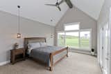 Vaulted ceiling in Master Bedroom with Ceiling Beam Detail and Pendant Lighting