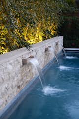 Pool Wall Fountains at Night with Birch Tree Light