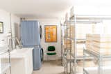 Laundry room with vintage furniture, art,  and J Schatz mold storage area