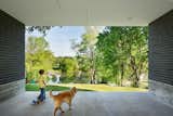 The carport frames a wonderful view of the river beyond and provides a sheltered play area during rain or excessive heat