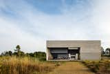 Exterior, Glass Siding Material, Concrete Siding Material, House Building Type, Metal Siding Material, and Flat RoofLine Dining room  Photo 6 of 19 in RF Residence by JSa