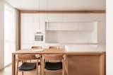 Kitchen, Wood Counter, Track Lighting, Stone Counter, and Accent Lighting  Photo 7 of 25 in Lull Apartments by BEZMIRNO