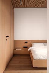 Bedroom, Track Lighting, Bed, and Accent Lighting  Photo 18 of 25 in Lull Apartments by BEZMIRNO