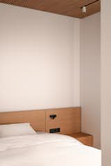 Bedroom, Track Lighting, Bed, and Accent Lighting  Photo 17 of 25 in Lull Apartments by BEZMIRNO