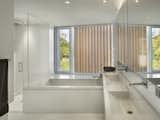 Bath Room, Corner Shower, Ceiling Lighting, and Stone Counter  Photo 12 of 13 in Spiral House by Joeb Moore & Partners