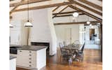 Dining Room, Table, Chair, Pendant Lighting, Standard Layout Fireplace, and Medium Hardwood Floor Berkshire Farmhouse Renovation Kitchen  Photo 5 of 16 in Berkshire Farm House by Catherine Truman Architects