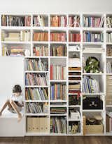 Floor-to-ceiling bookshelves provide ample storage for books and memorabilia. 