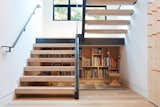 In a family home in Mill Valley, California, Lauren Goldman of l’oro designs kept her clients’ goals of “modern yet accessible” in mind while also looking for opportunities to add functionality. This proved successful when she discovered that the empty space under the steel-and-glass stair landing was the perfect scale for children to sit and read under. The team was inspired to create a kid-sized library, turning a useless space into a perfectly cozy reading nook.