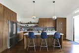 Kitchen, Refrigerator, Wood, Dark Hardwood, Pendant, Recessed, Range, Subway Tile, and Undermount  Kitchen Range Subway Tile Dark Hardwood Photos from A Silver Lake Home Built in 1939 Is Renovated From Top to Bottom