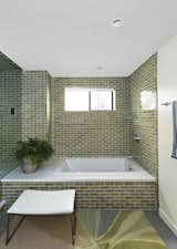 Bath Room, Rug Floor, Recessed Lighting, Subway Tile Wall, and Soaking Tub  Photos from A Silver Lake Home Built in 1939 Is Renovated From Top to Bottom
