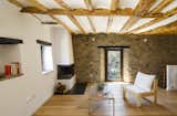 Barcelona-based architecture firm Acabadomate rehabilitated this abandoned 1894 farmhouse in the rolling hills of Catalonia’s Alt Urgell region. Inside the 2,100-square-foot residence, the original stone walls and wooden ceiling beams were cleaned and restored to their natural finish.&nbsp;
