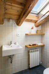 Modern bathrooms were installed using natural materials and simple fixtures.