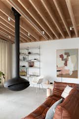 <span style="font-family: Theinhardt, -apple-system, BlinkMacSystemFont, &quot;Segoe UI&quot;, Roboto, Oxygen-Sans, Ubuntu, Cantarell, &quot;Helvetica Neue&quot;, sans-serif;">"Rick and Lucy were having a hard time figuring out the location of the fireplace...They wanted the comfort of the fire, but didn’t want the unit to impede on the flow or block the views. Lucy stated that she loves to keep her rooms flexible so she can easily change the layout. This conversation led to the idea of a suspended central fireplace.</span><span style="font-family: Theinhardt, -apple-system, BlinkMacSystemFont, &quot;Segoe UI&quot;, Roboto, Oxygen-Sans, Ubuntu, Cantarell, &quot;Helvetica Neue&quot;, sans-serif;"> By thinking outside the box, they have allowed for the most wonderful living room experience.</span>